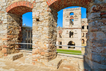 Obraz premium Tower of Krzyztopor castle framed in brick arch, Ujazd, Poland
