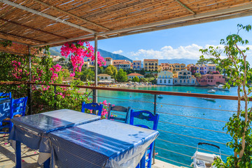 View of beautiful bay Assos fishing village from Greek tavern, Kefalonia island, Greece