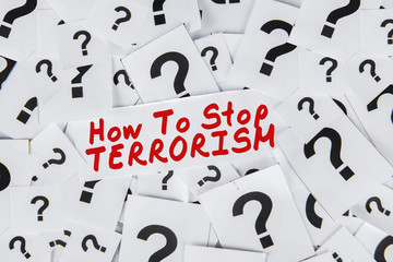 Question marks with text of how to stop terrorism