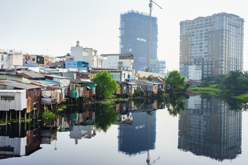 The contrast between slum houses and buildings in Ho Chi Minh city, Vietnam. Ho Chi Minh city (aka Saigon) is the largest city and economic center in Vietnam with population around 10 million people.