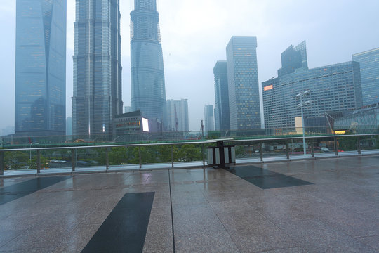 Empty marble floor road with modern city architecture background