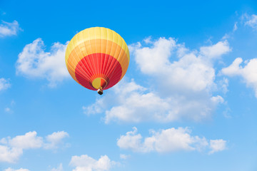 Fototapeta na wymiar Colorful hot air balloon with blue sky background