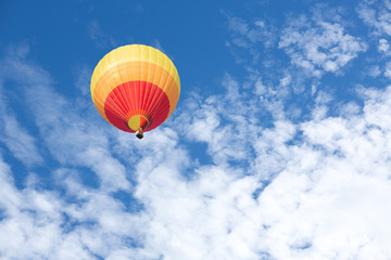 Colorful hot air balloon with blue sky background