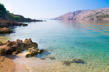 The pristine coastline and crystal clear water of the island of