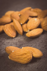 Vintage photo, Heap of almonds on concrete structure