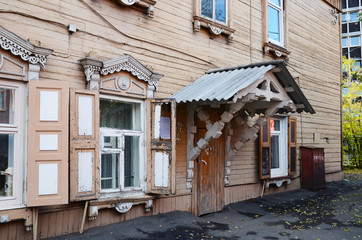 Two-storey wooden house with porch and window shutters on Irkutsk street