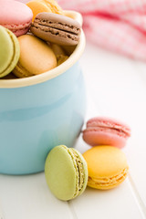 sweet french macarons on kitchen table