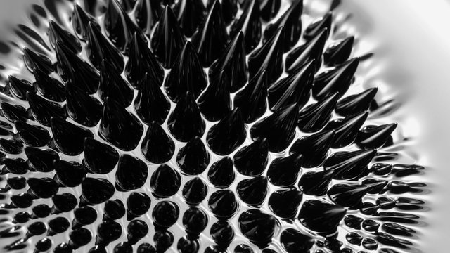 Black liquid surface. Abstract background. Ferrofluid. Сlose-up 4K UHD.