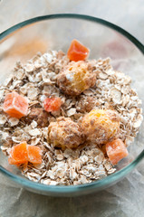 Bowl of cereal and dried fruits for healthy breakfast macro