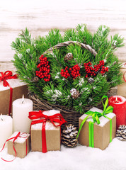 Christmas decoration with burning candles and gift box