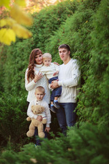 Fototapeta premium beautiful happy family in sweaters with his two sons in the fore