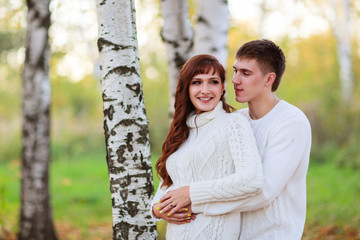 Fototapeta premium love, happy couple in park with birch trees, summer, autumn suns