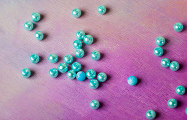 string of pearls delicate pink color, in soft focus, with highlights