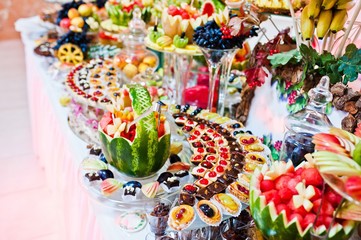 Wedding reception. Table with fruits and sweets