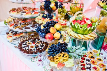 Wedding reception. Table with fruits and sweets