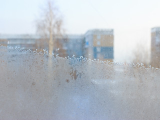 This is frosty pattern on glass winter window.