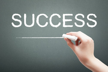 Hand writing with chalk success concept