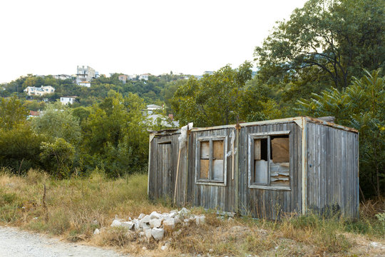 old abandoned hut with windows and door
