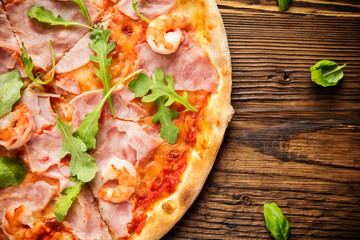 Delicious italian pizza served on wooden table