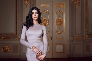 Beautiful sexy woman in elegant dress fashionable autumn Collection of spring long brunette hair...