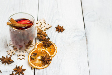 Christmas mulled wine on a white rustic wooden table
