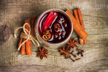 Christmas mulled wine on a rustic wooden table