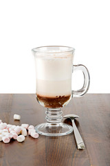 A glass of hot chocolate with marshmallows