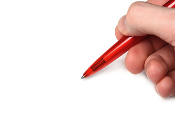 Hand mit rotem Kugelschreiber 