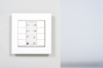 white modern electrnic switch on the wall