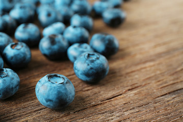 Fresh blueberries on wooden table, closeup
