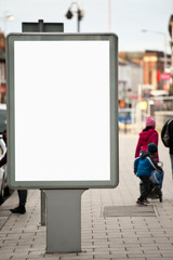 Fototapeta premium Vertical Isolated blank billboard on the city street
