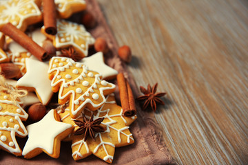 Christmas cookies with spices on wooden table