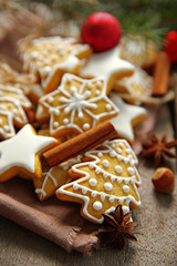 Cookies with spices and Christmas decor, on wooden table