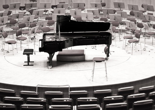 Black piano on the big stage. Philharmonic stage