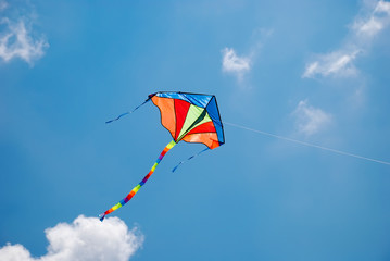 Fototapeta na wymiar colorful kite flying in the wind