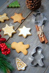 Christmas cookies and cinnamon on wooden table