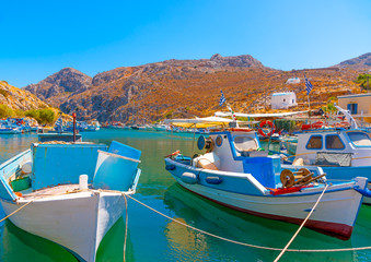 traditional fishing boats  docked at the port of Vathi village in Kalymnos island in Greece