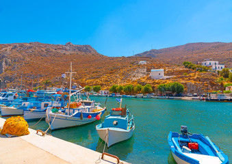 traditional fishing boats  docked at the port of Vathi village in Kalymnos island in Greece