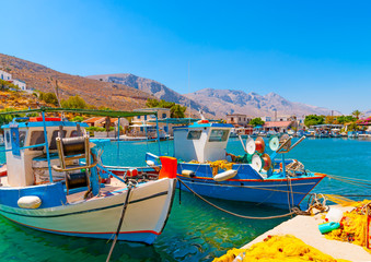 traditional fishing boats  docked at the port of Vathi village in Kalymnos island in Greece - 96969090
