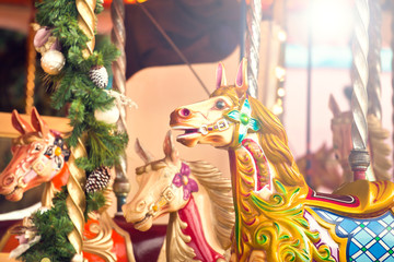 Fototapeta na wymiar Carousel. Horses on a carnival Merry Go Round.