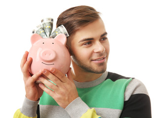 Man with money box and banknotes in it isolated on white