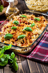 Casserole fusilli pasta with sausage, zucchini and cheese