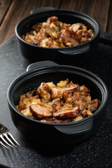 Potatoes baked with sausage and bacon