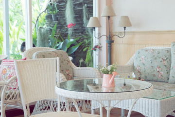 design of vintage style interior in cafe with flowers vase