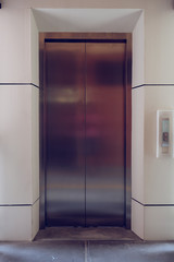 modern metal elevator close door in building office