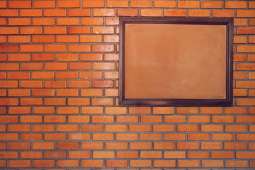 blank noticeboard message on brick wall background