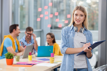 Cheerful four office workers are discussing project