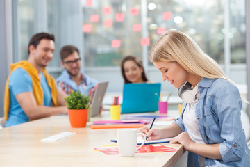 Attractive young designers are discussing new project