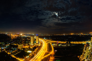 Fototapeta premium Panoramic view of National Route 1A in Ho Chi Minh city (or Saigon) in twilight by fisheye lens, Vietnam