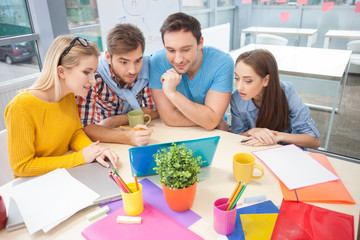 Cheerful young designers are working with joy